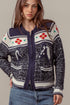 Woman wearing a patterned sweater with a neutral background