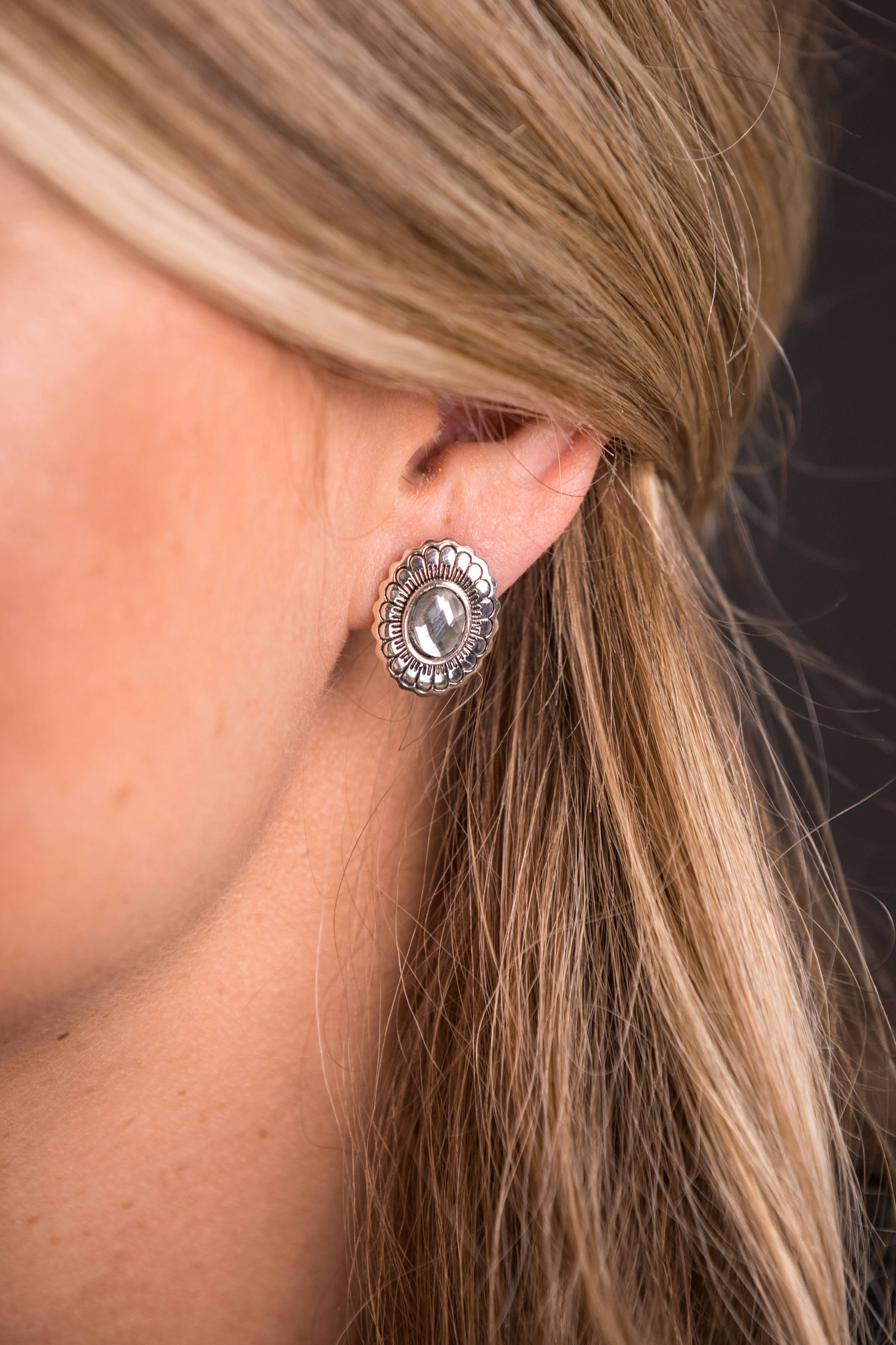 Canyon Flower Concho Earrings featuring burnished silver with flower stamped design and rhinestone accent