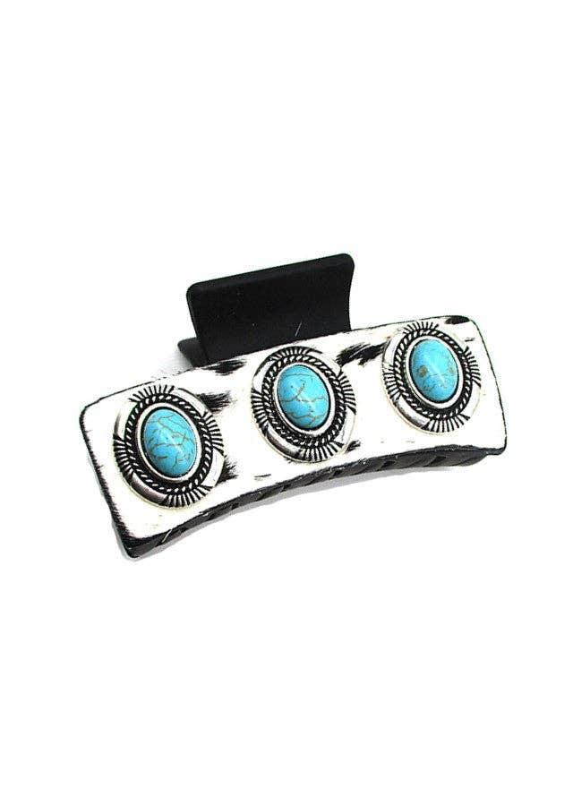 Hair clip with turquoise stones on a white background