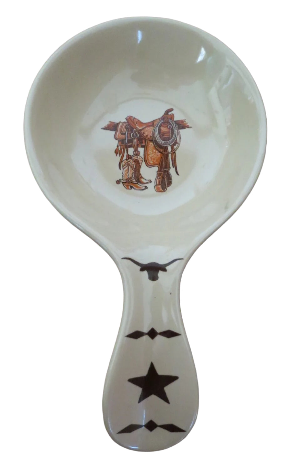 Ceramic spoon rest featuring a bronco buster design, beige glaze, and dark brown longhorn and star details. Measures 7.5 inches long x 4 inches in diameter. Dishwasher safe.