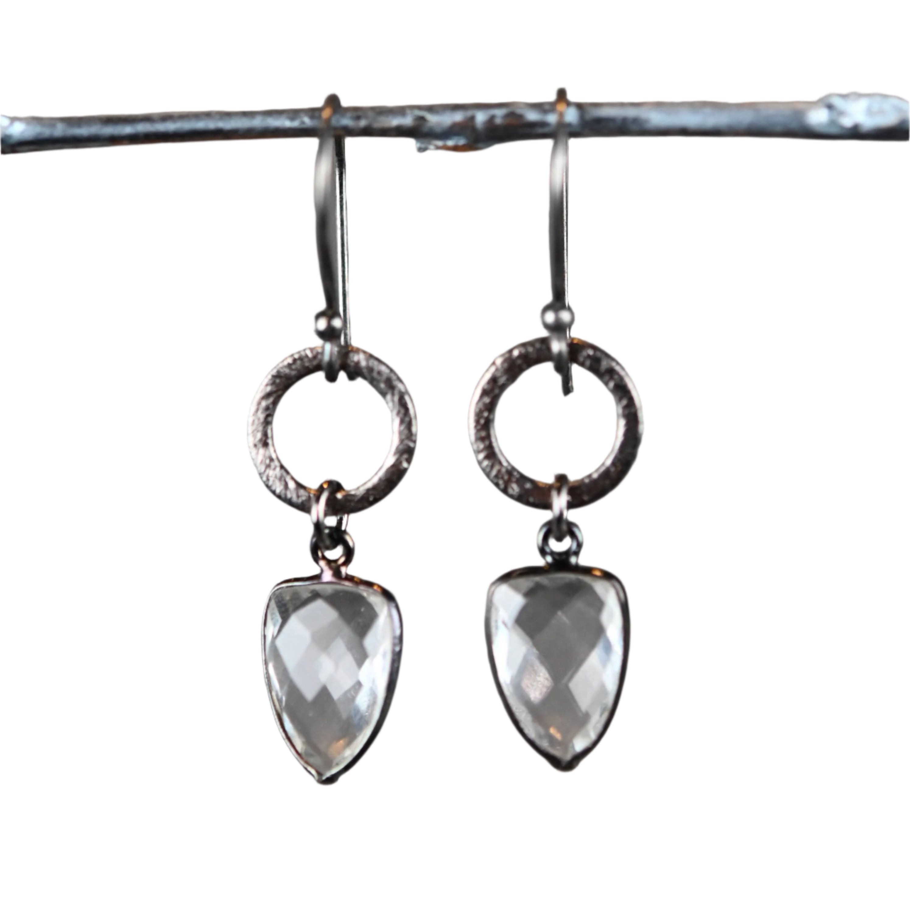 Crystal Cascade Earrings featuring brushed gunmetal circles with faceted trillion-cut hydro quartz drops, measuring 1.75 inches. Handmade with Art & Soul in Los Angeles.