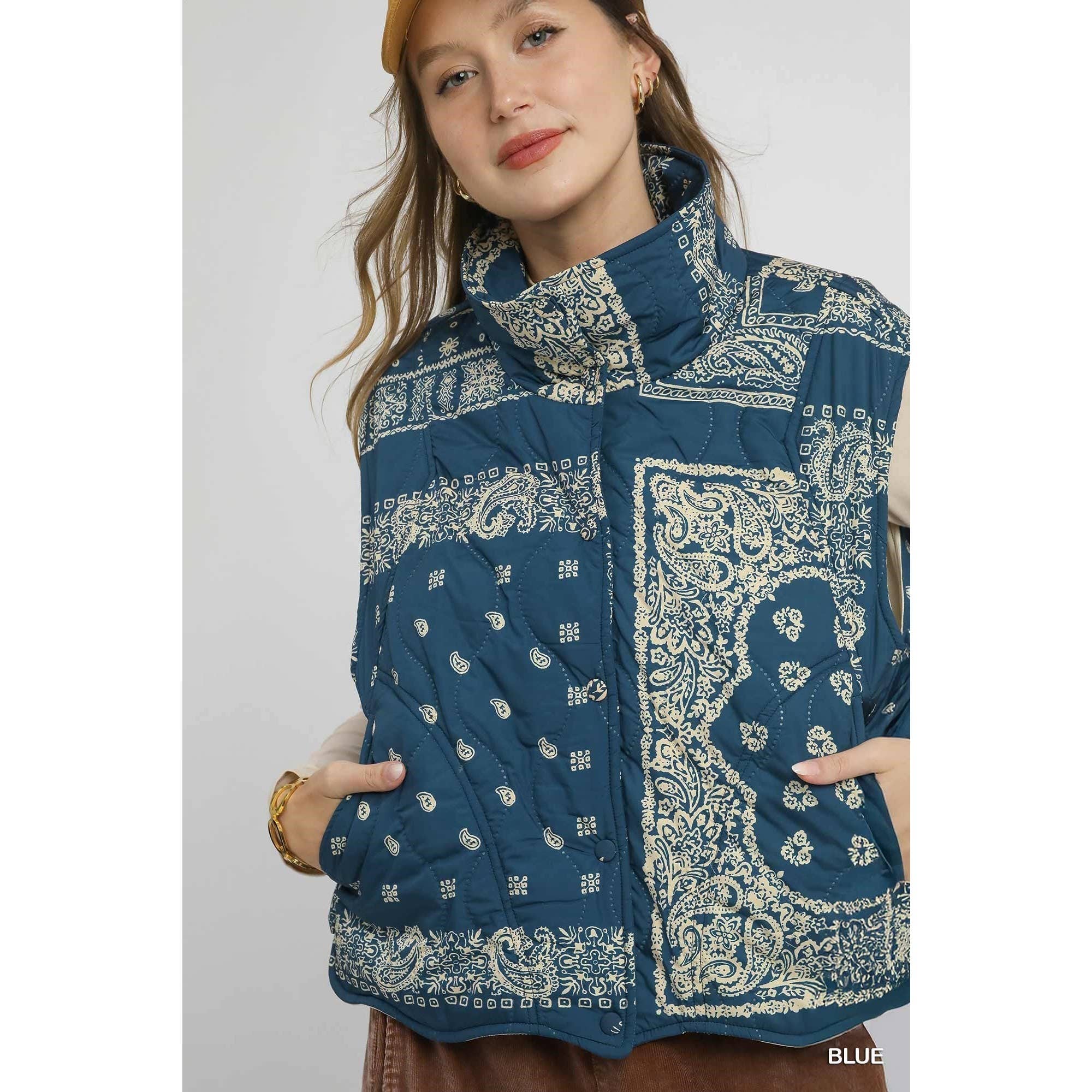 Woman wearing a blue patterned jacket on a white background