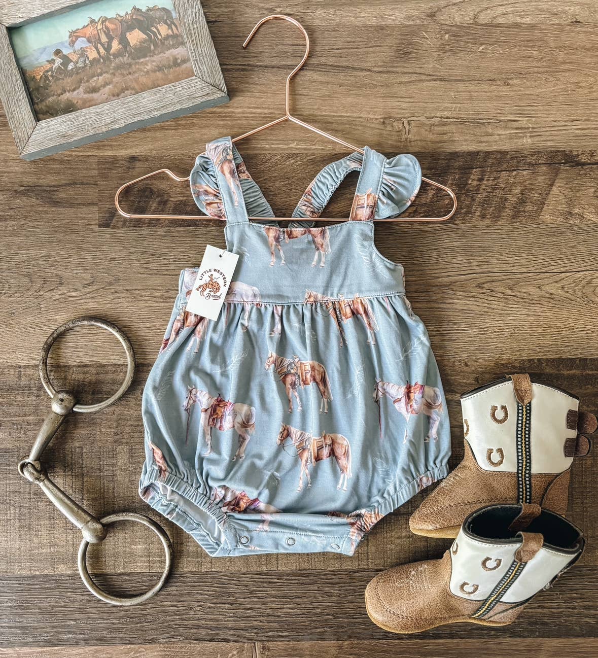 Baby bamboo ruffle bubble romper in dusty blue with hand painted western horse print, lightweight infant outfit with snap closure