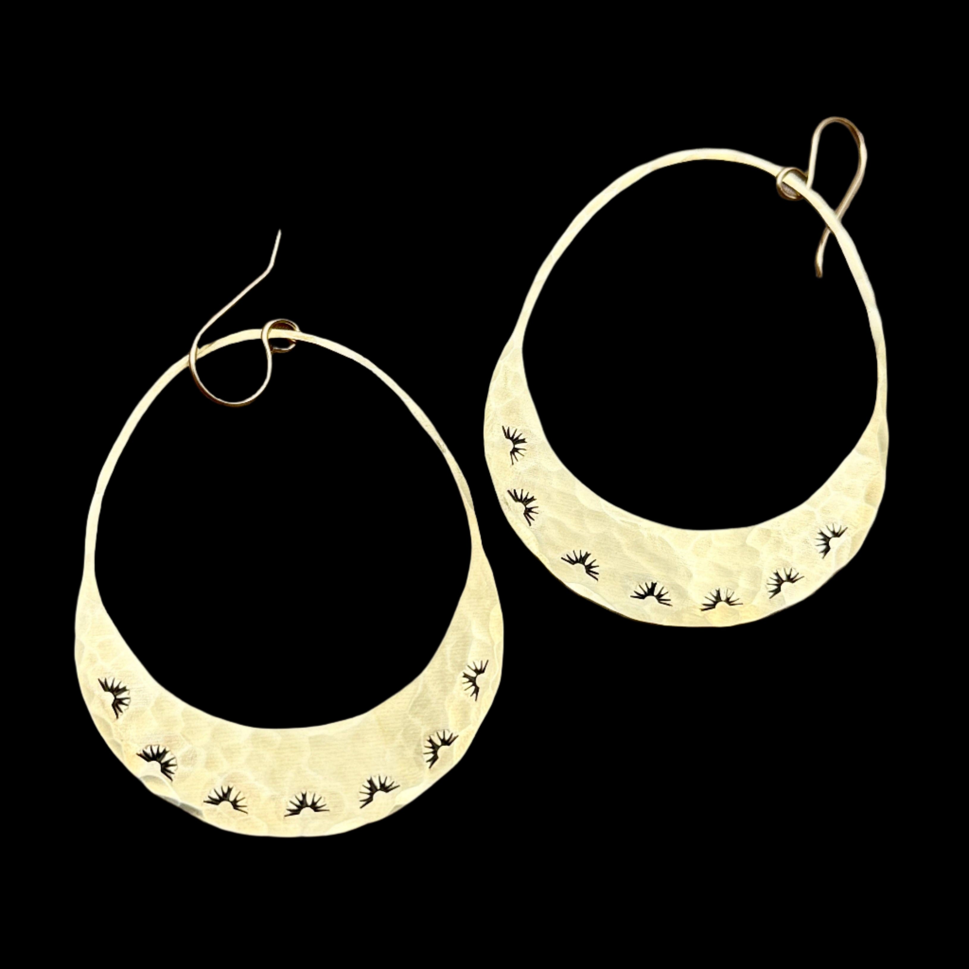 Handmade Western Sunrise Earrings featuring raw brass stamped crescent pendants, hanging from hypoallergenic 14k gold-filled ear wires.