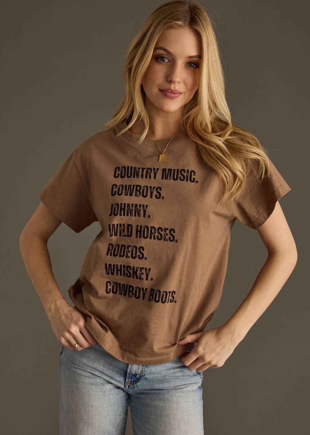 Woman wearing a brown t-shirt with text on a gray background