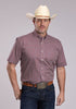 Man wearing a short sleeve Roper button-down shirt with red clay geometric print, button-down collar, and chest pocket, paired with dark denim jeans and a cowboy hat.