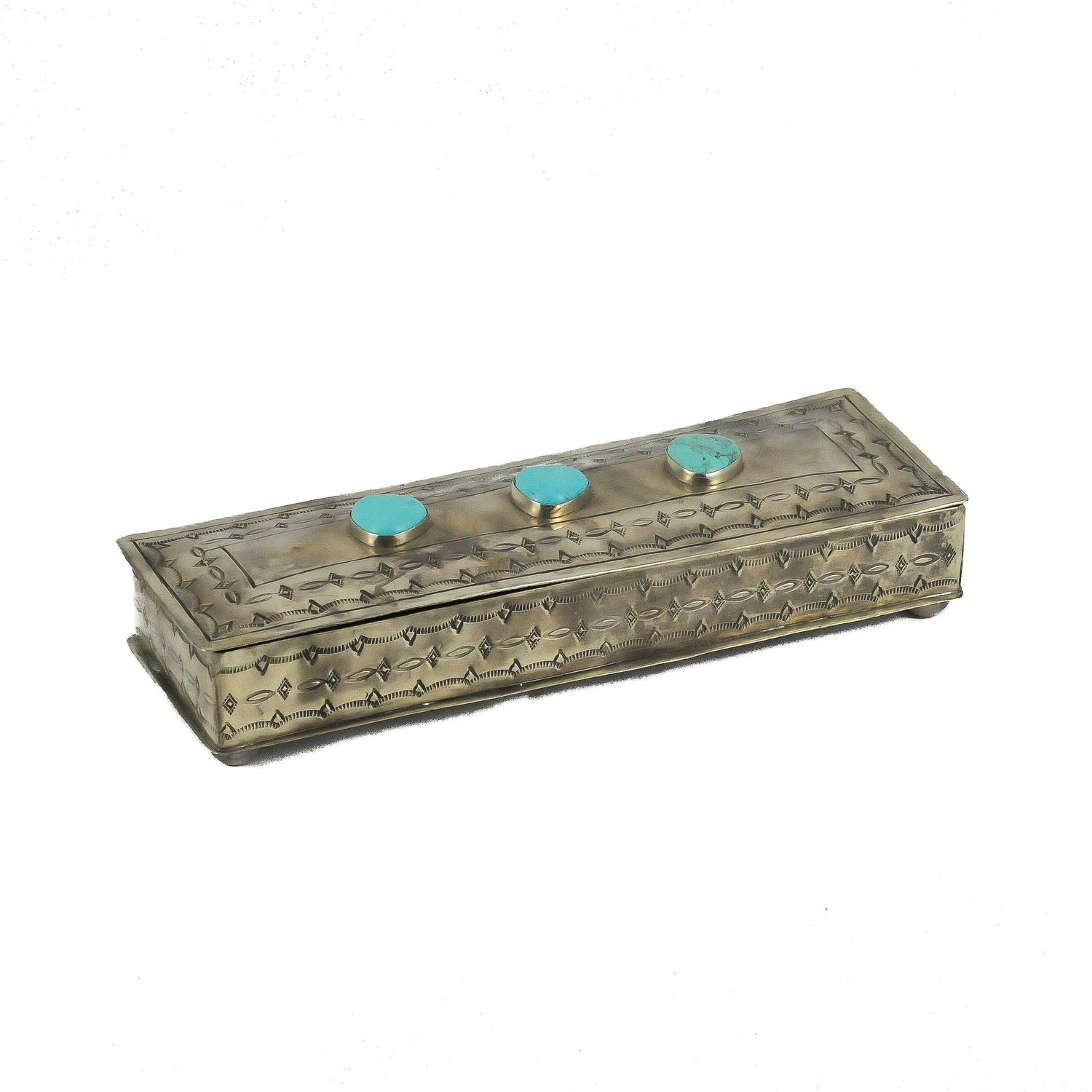 Decorative box with turquoise knobs on a white background