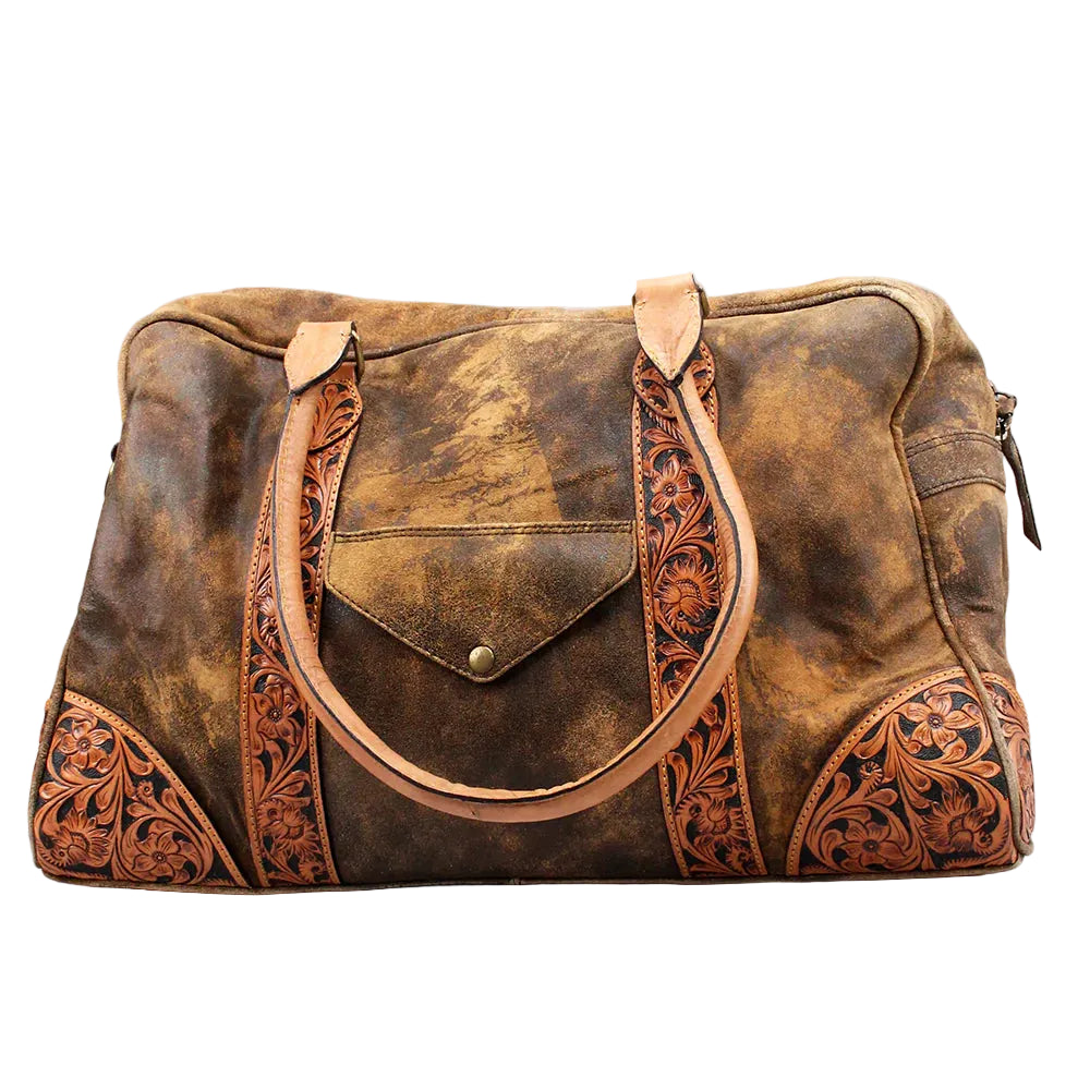 Brown leather bag with intricate patterns on a light gray background