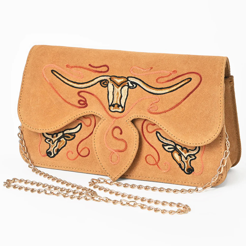 Tan handbag with embroidered longhorn design on a white background