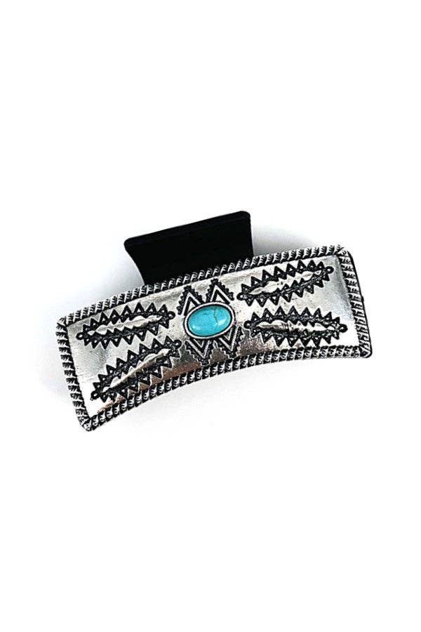 Silver hair clip with turquoise stone on a white background