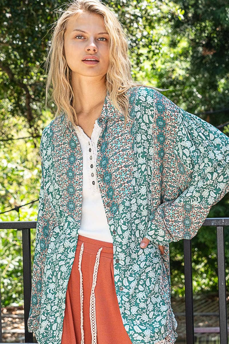 Woman wearing a floral kimono in an outdoor setting