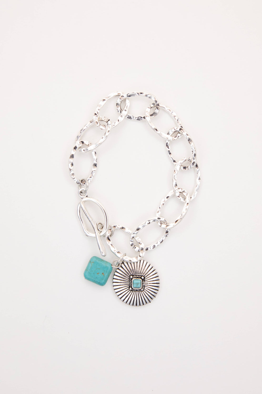 Bracelet with turquoise charm on a white background