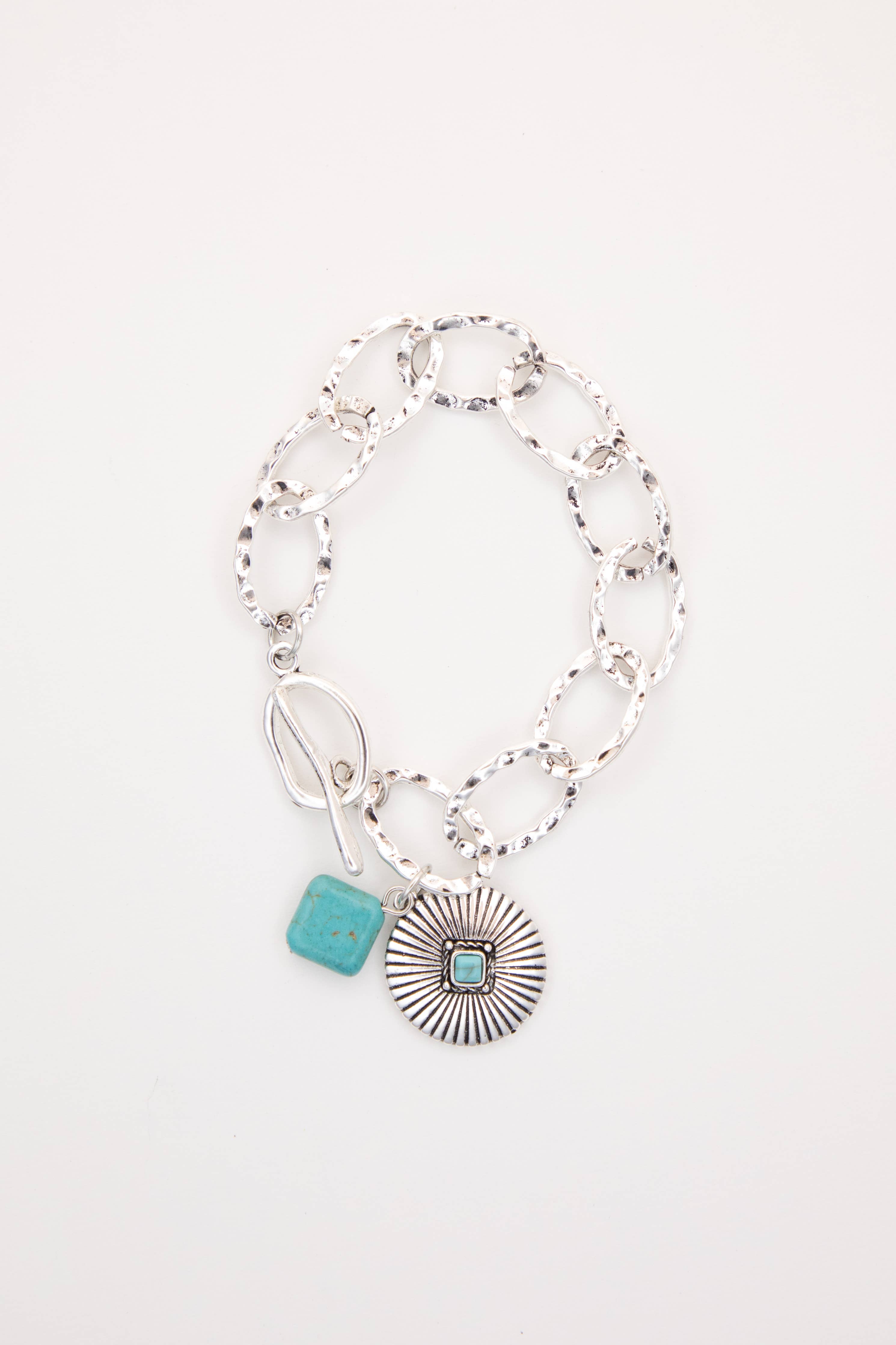 Bracelet with turquoise charm on a white background