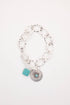 Bracelet with turquoise charm on a white background