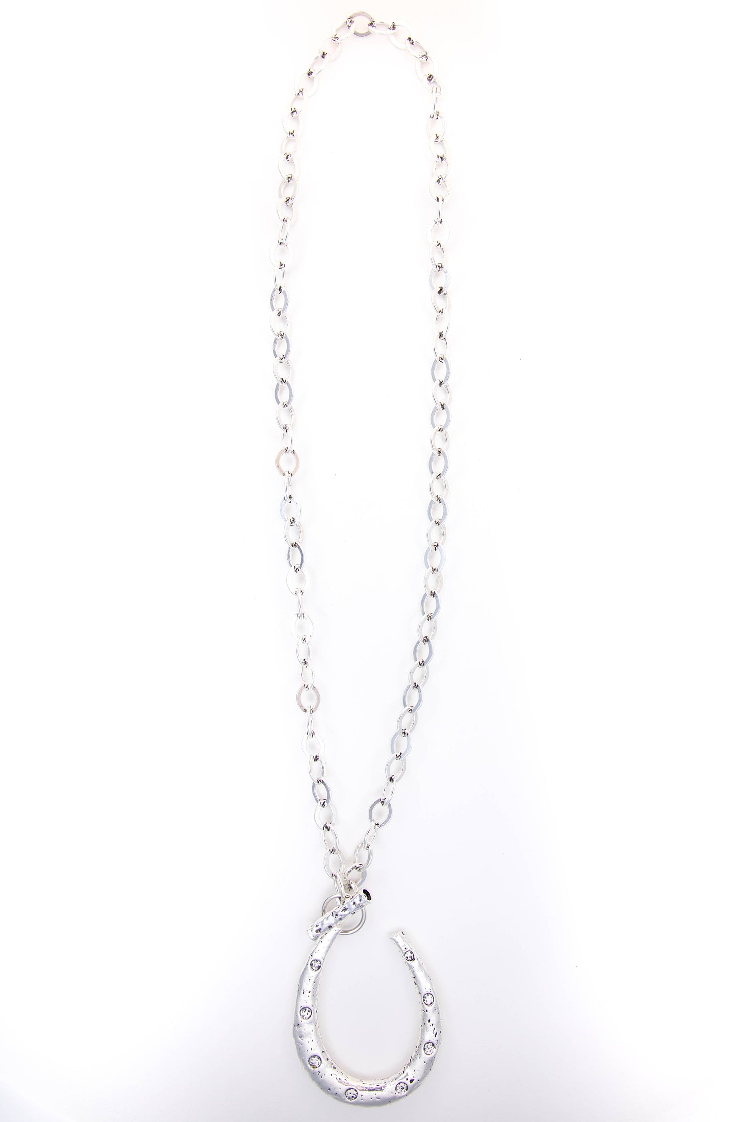 Silver necklace with a horseshoe pendant on a white background