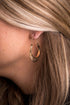 Elegant burnished gold sun stamped hoop earrings, capturing the essence of the west.