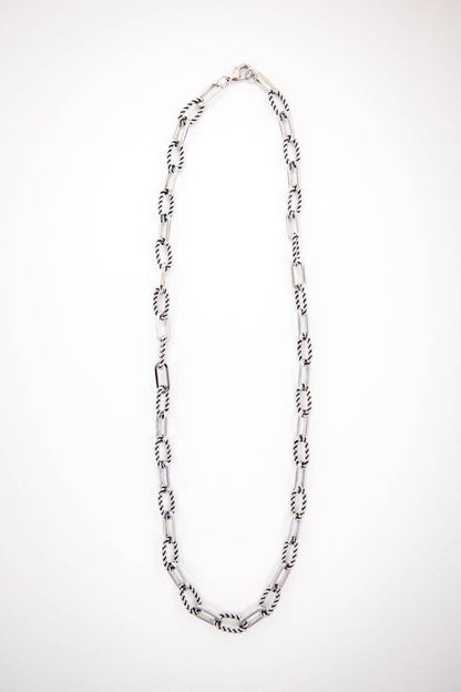 Silver chain necklace on a white background