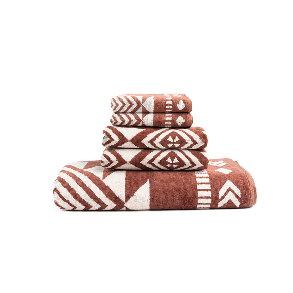 Tribal Horizon Towel featuring a timeless geometric pattern in warm, earthy tones. Crafted for softness and absorbency, this generously sized towel brings a spa-like touch to any space. Available in Bath Towel (30x60), Face Towel (18x30), and Hand Towel (13x13).