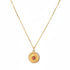 Gold necklace with a sun pendant on a &