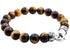 Beaded bracelet with tiger eye stones and a silver clasp on a white background