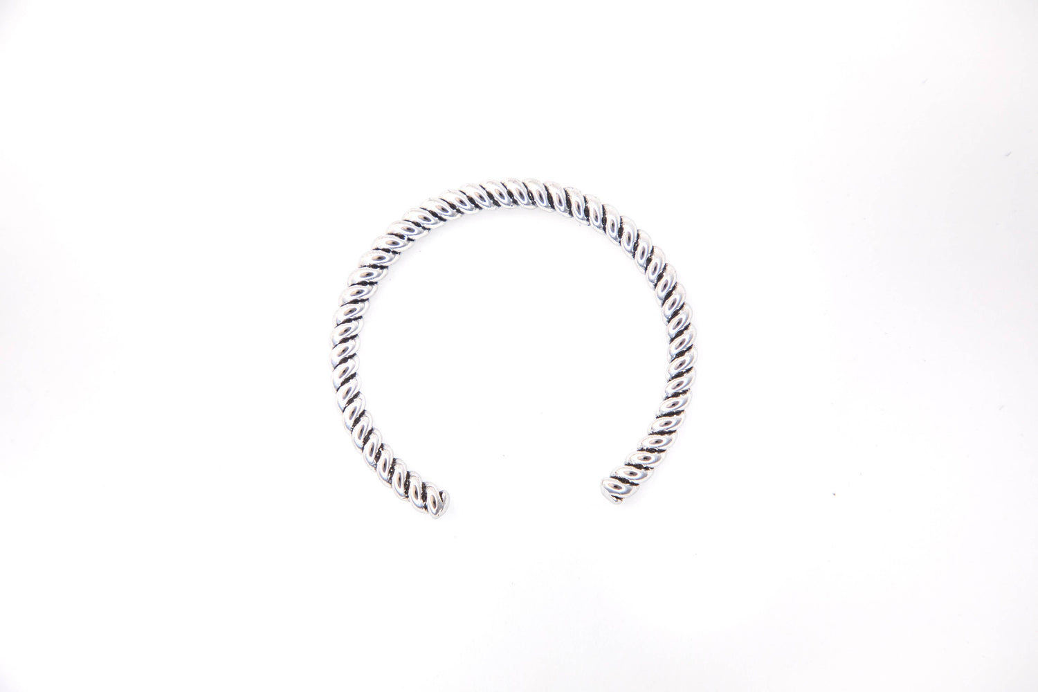 Silver hoop earring on a white background