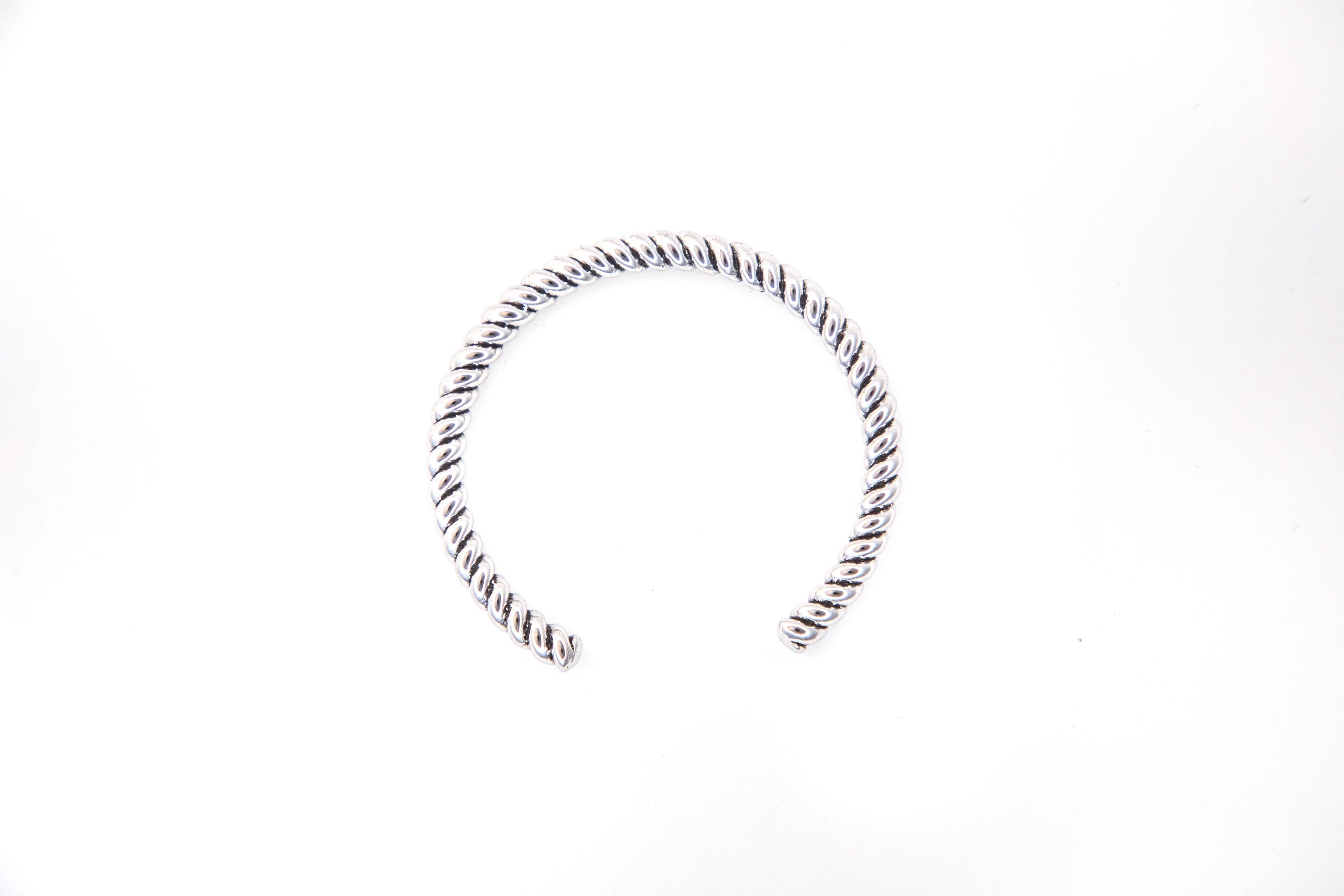 Silver hoop earring on a white background