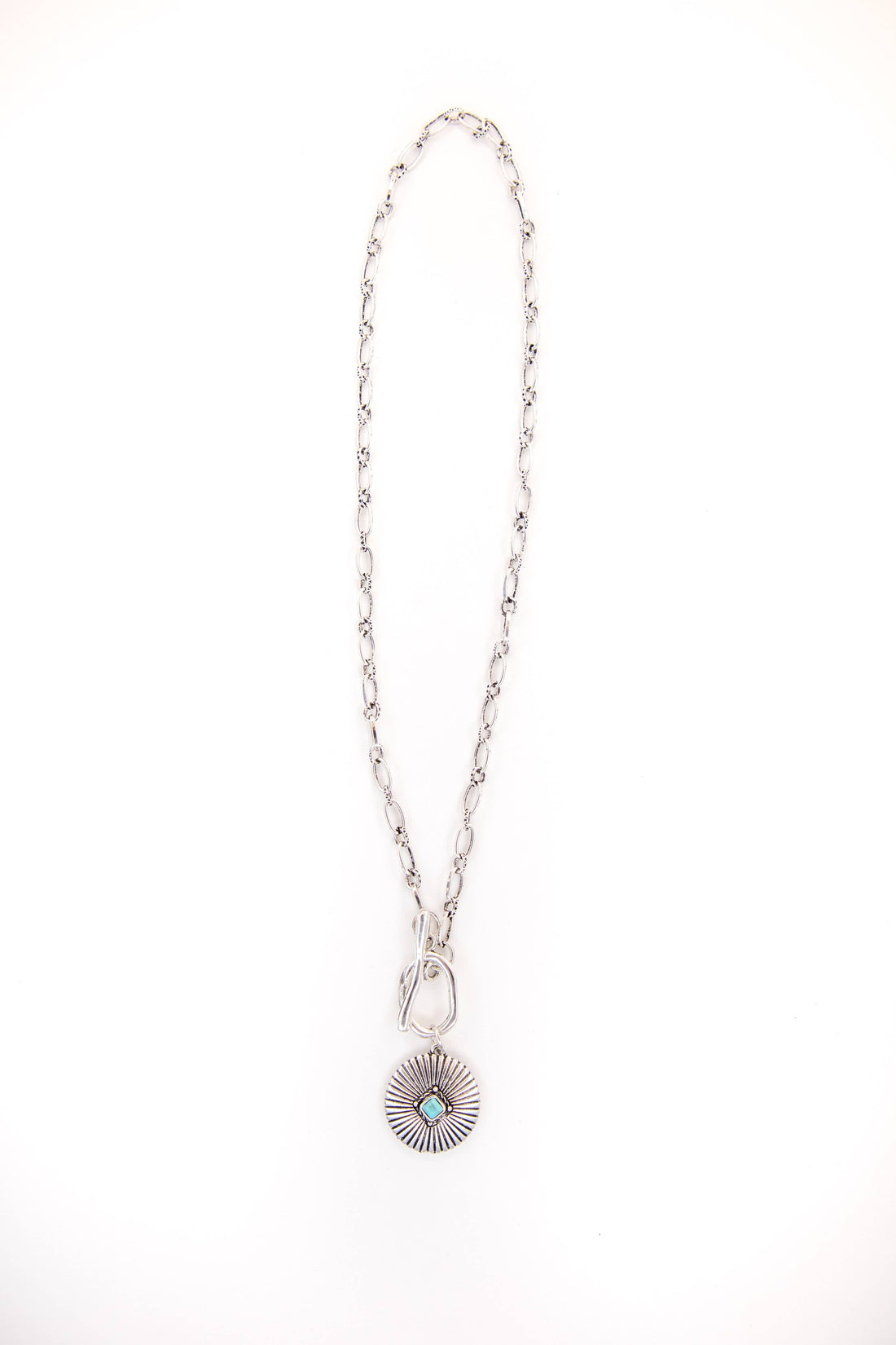 Silver necklace with a pendant on a white background