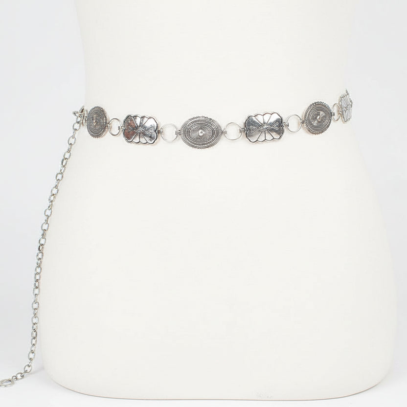 Black western concho belt with antique silver metal plates and turquoise stone detail for styling over dresses or denim