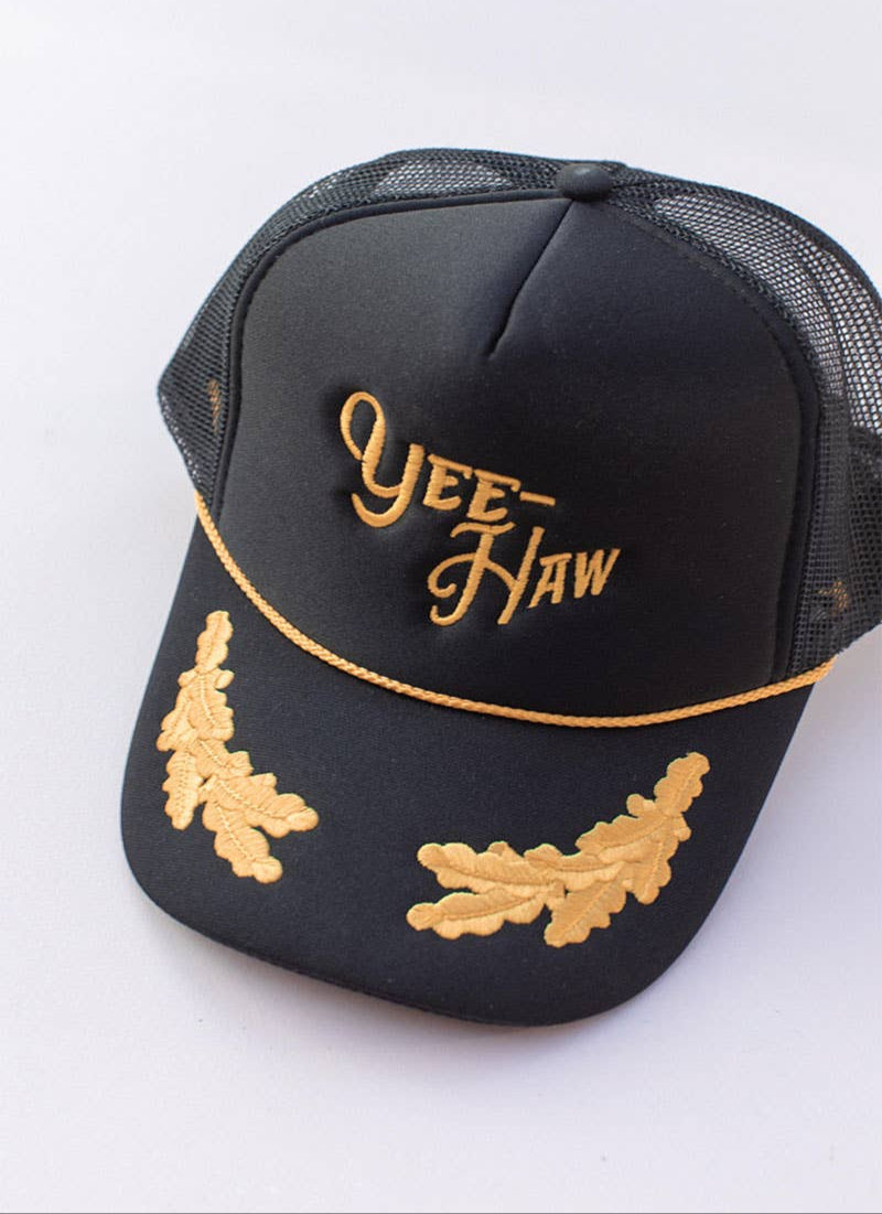 Black cap with gold embroidery on a white background
