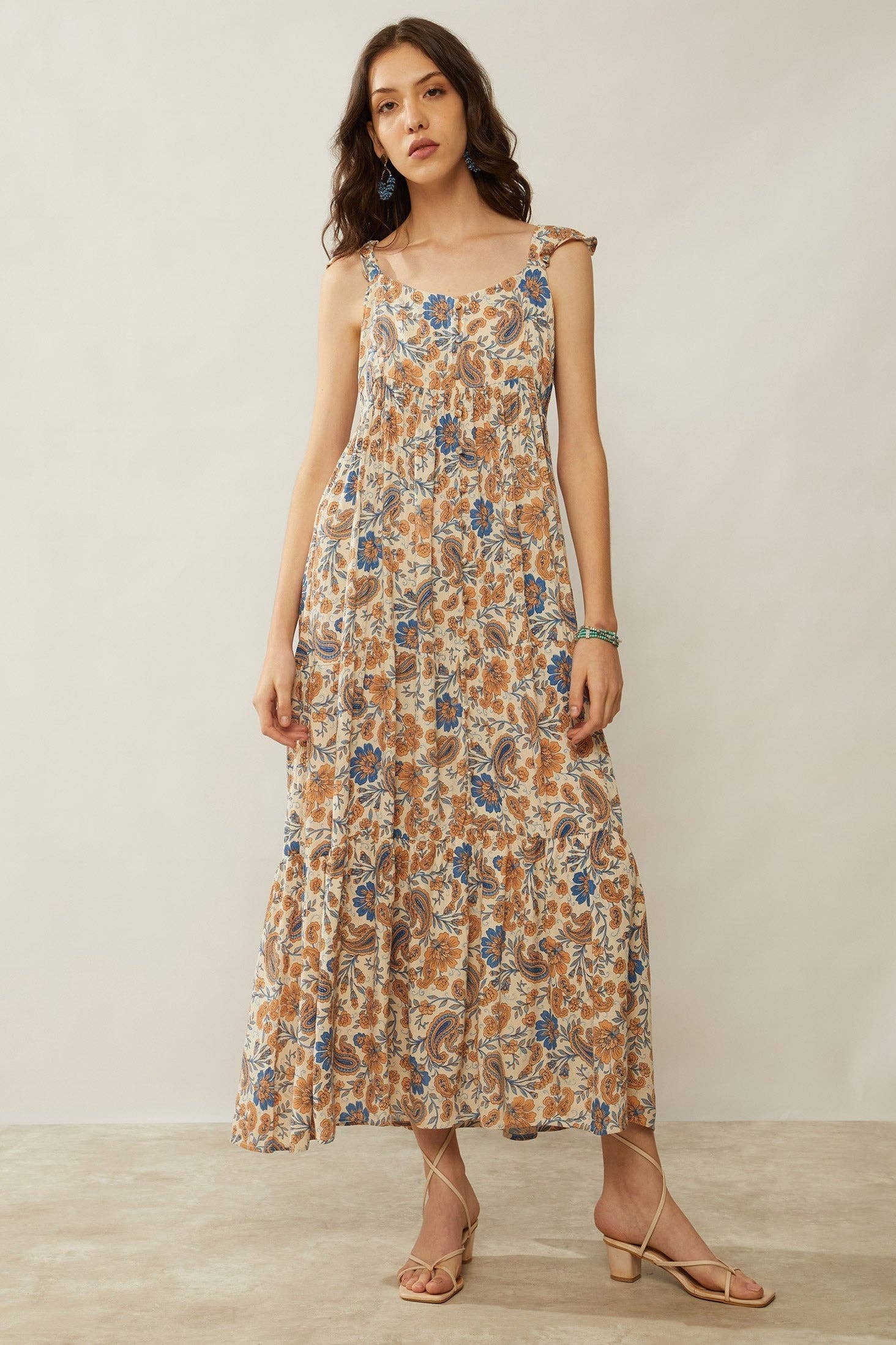 Western floral maxi dress with paisley print, gathered waist, ruffle straps, and flowing silhouette