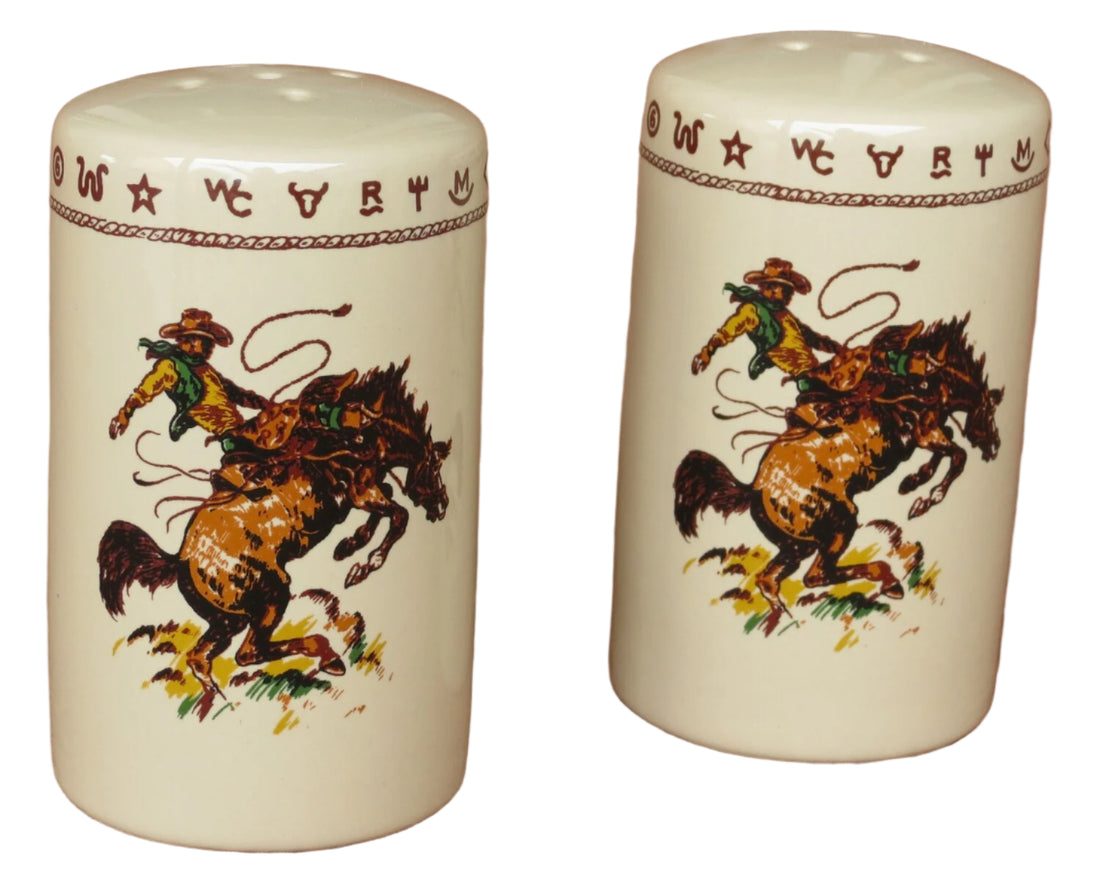 Western salt and pepper shaker set featuring a bronco buster illustration, beige glaze with dark brown rope and brand details. Measures 2.5 inches in diameter x 4 inches tall. Dishwasher safe.