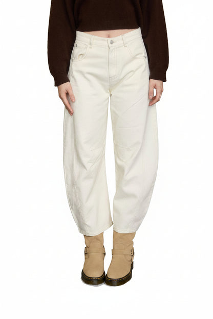 Cream high-waist barrel jeans with wide cropped leg, panel detail, and structured fit