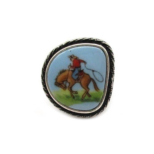 Ring with a cowboy on horseback design on a white background