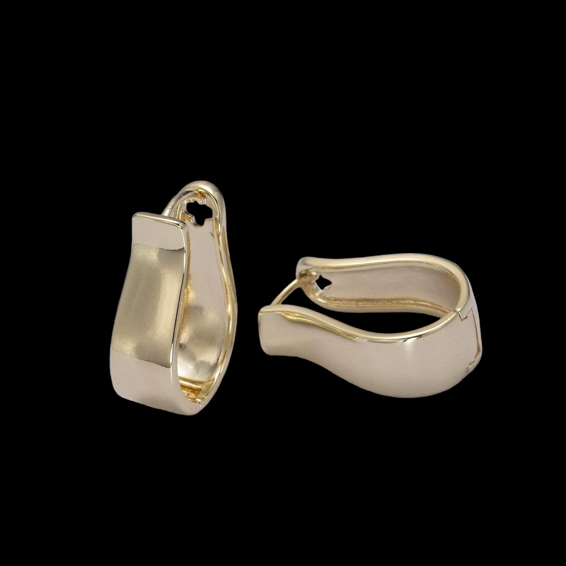 Gold hoop earrings on a light gray background