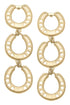 A pair of gold-tone dangle earrings featuring three interlinked horseshoes, creating a bold yet elegant equestrian-inspired statement piece. Perfect for adding a touch of luck and style to any outfit.