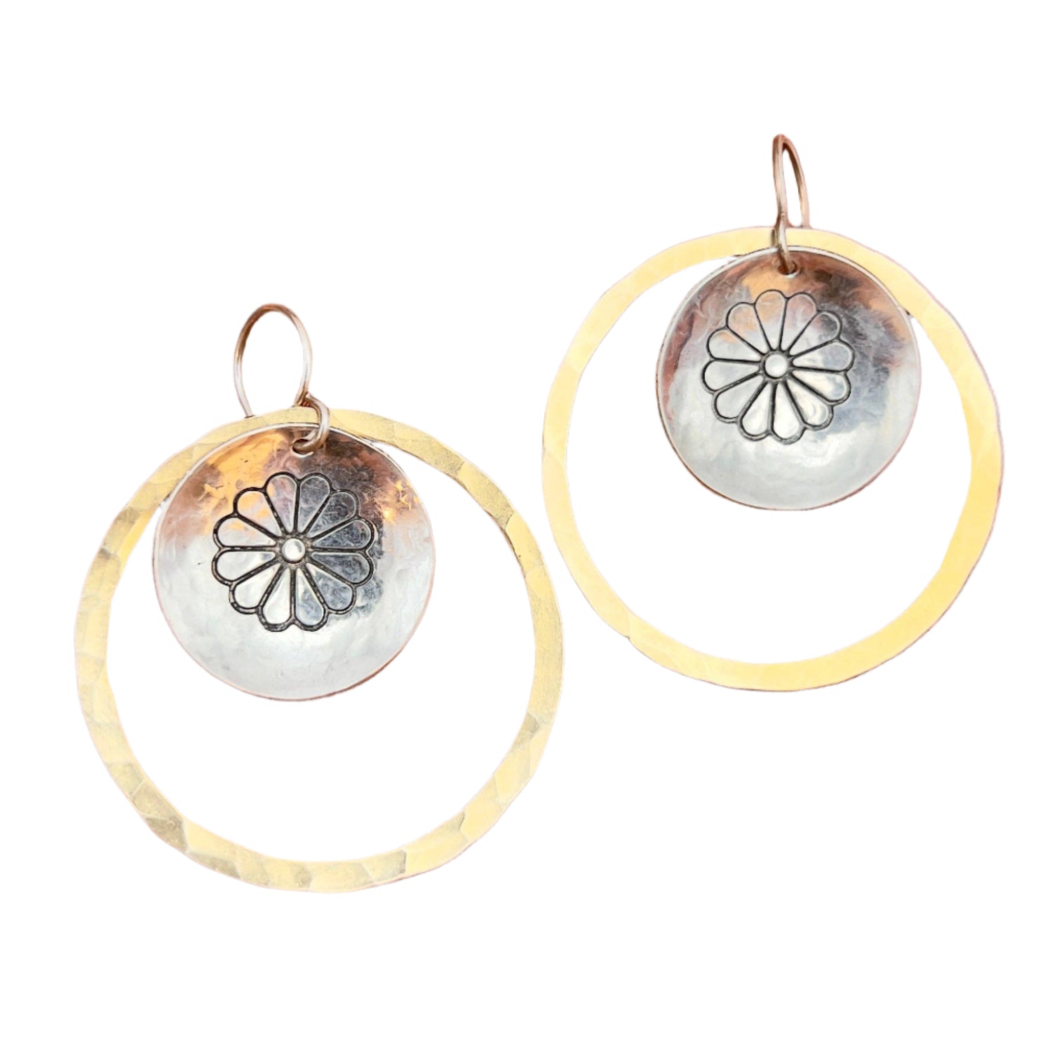 Handmade Desert Bloom Hoops featuring a hammered gold hoop with a domed silver concho and floral motif, hanging from hypoallergenic sterling silver ear wires
