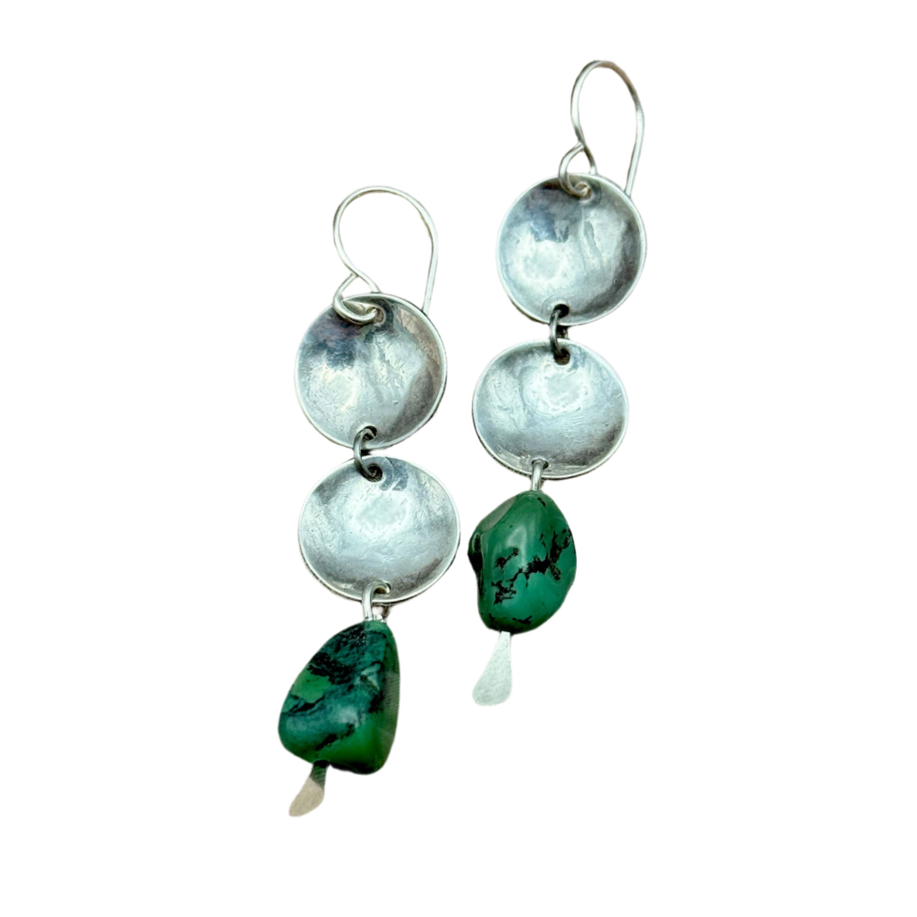 Handmade Desert Cascade Earrings featuring two silver circular dapped pendants with a turquoise nugget, hanging from hypoallergenic sterling silver ear wires.