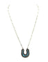 Necklace with a turquoise horseshoe pendant on a white background