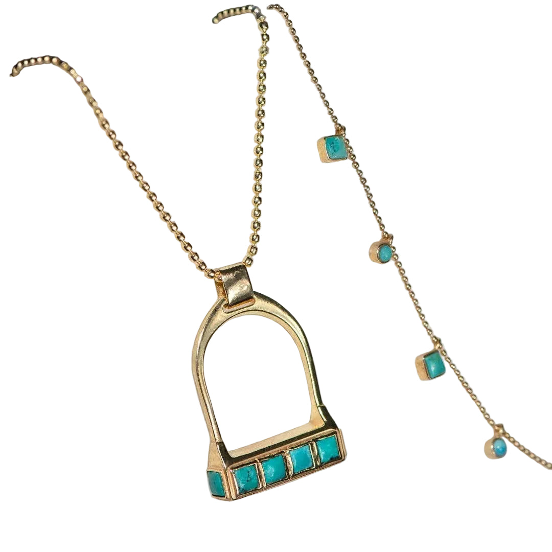 Gold necklace with turquoise stones on a white background