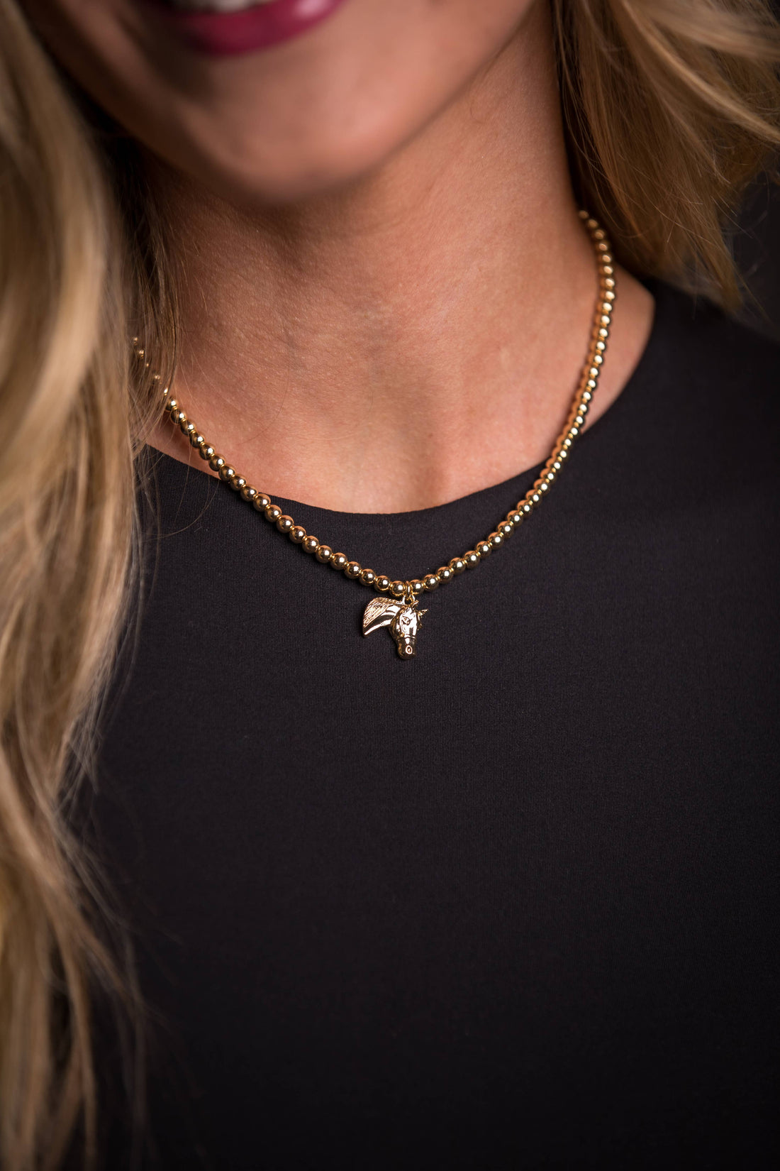 Golden Stallion Navajo Pearl Necklace featuring dainty gold faux Navajo pearls with an elegant gold horse head charm, showcasing classic Western elegance