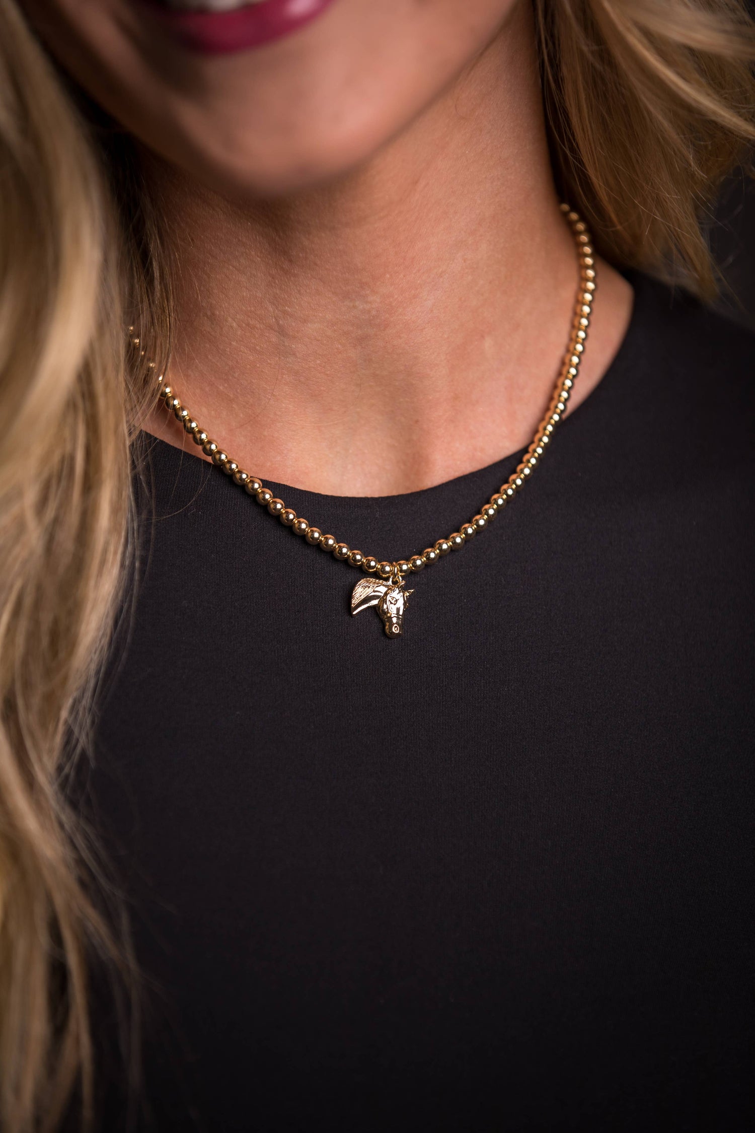 Golden Stallion Navajo Pearl Necklace featuring dainty gold faux Navajo pearls with an elegant gold horse head charm, showcasing classic Western elegance
