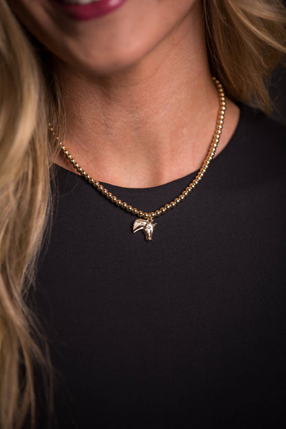 Golden Stallion Navajo Pearl Necklace featuring dainty gold faux Navajo pearls with an elegant gold horse head charm, showcasing classic Western elegance