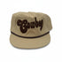 Infant cowboy cap in khaki with brown embroidered “Cowboy” lettering and rope detail across the brim, western-style baby hat