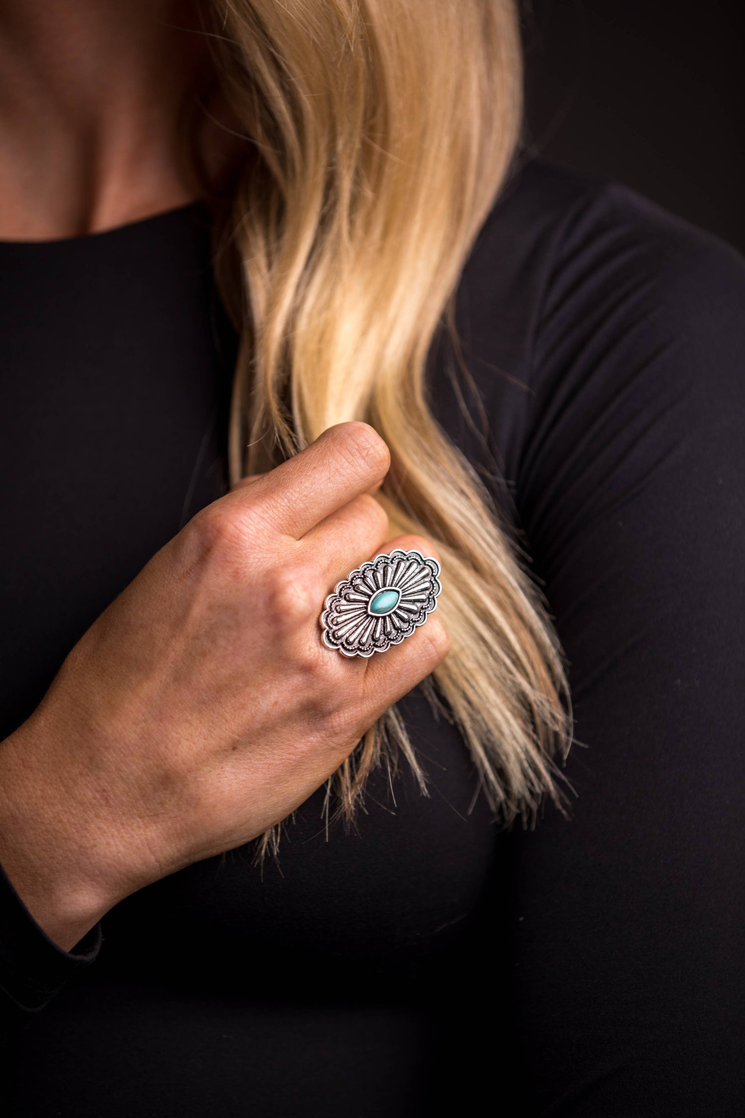 Navajo Bloom Ring featuring an adjustable oval concho design with intricate silver detailing and a turquoise accent, inspired by Southwestern heritage