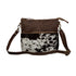 Point Rock Crossbody Bag – Aged bourbon chocolate-stamped leather and hair-on hide crossbody with zip-top closure, zippered pockets, and a matching leather shoulder strap.