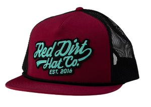 Red Dirt Hat Co. Off The Vine Hat featuring a burgundy front panel, black mesh back, teal 3D embroidered logo patch, rope detail, and a flat bill.