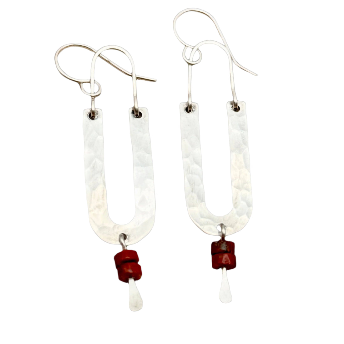 Handmade Red Rock Arch Earrings featuring textured silver arched pendants with Red Jasper heishi beads, hanging from hypoallergenic sterling silver ear wires.