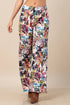 Western rodeo graphic print wide-leg pants with a front button, zipper closure, and elastic back waistband.