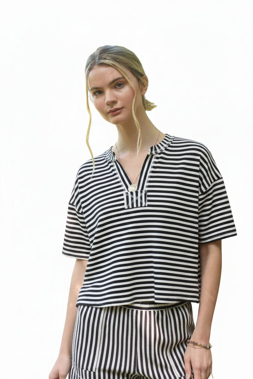 Brown and cream striped knit top with split neckline, short sleeves, and relaxed boxy fit