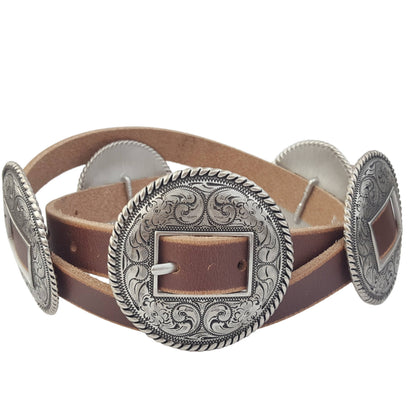 The Bridlewood Belt with antique silver engraved conchos on brown distressed leather skinny belt